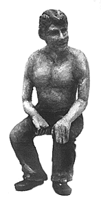 Shirtless Seated Man