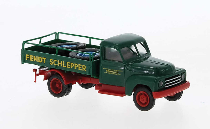 1950-1960 Hanomag L 28 Low-Side Delivery Truck with Tire Load - Assembled -- Fendt Schlepper (green, red, yellow, German Lettering)