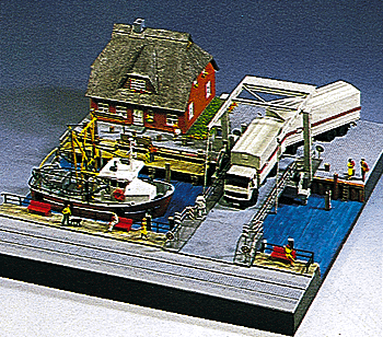 Wharf w/blds/boat/bridge