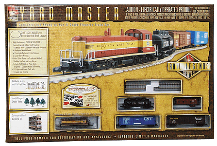 Rail Legends Series Yard Master Diesel Freight Set -- Florida East Coast w/Power-Loc(tm) 21x31" Oval SW9 w/3 Cars & Caboose