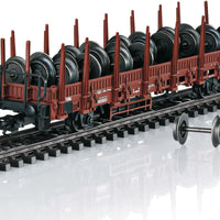 Type Kbs 442 Stake Car with Railroad Wheel Load - 3-Rail - Ready to Run -- German Federal Railroad DB (Era IV 1982, Boxcar Red)