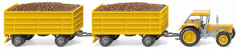 Schluter 1250 VL Farm Tractor -- With 2 4-Wheel Beet Trailers (yellow)