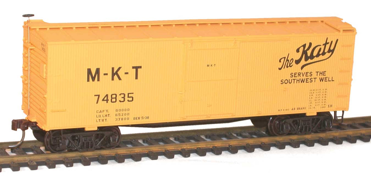 36' Double-Sheathed Wood Boxcar, Steel Roof, Ends,  Fishbelly Underframe Kit -- Missouri-Kansas-Texas #74835 (yellow, black; "Katy Serves the Southwest")