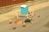 Building Site Details - SceneScapes(TM) -- Outhouse, Wheelbarrow, Barricade, Traffic Cones and Dirt Pile-1