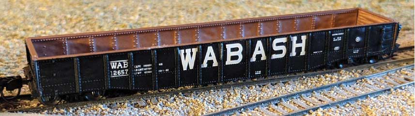 52'6" 15-Panel Mill Gondola - Heavily Dented Sides - Ready to Run -- Wabash # 12657 (black, white)