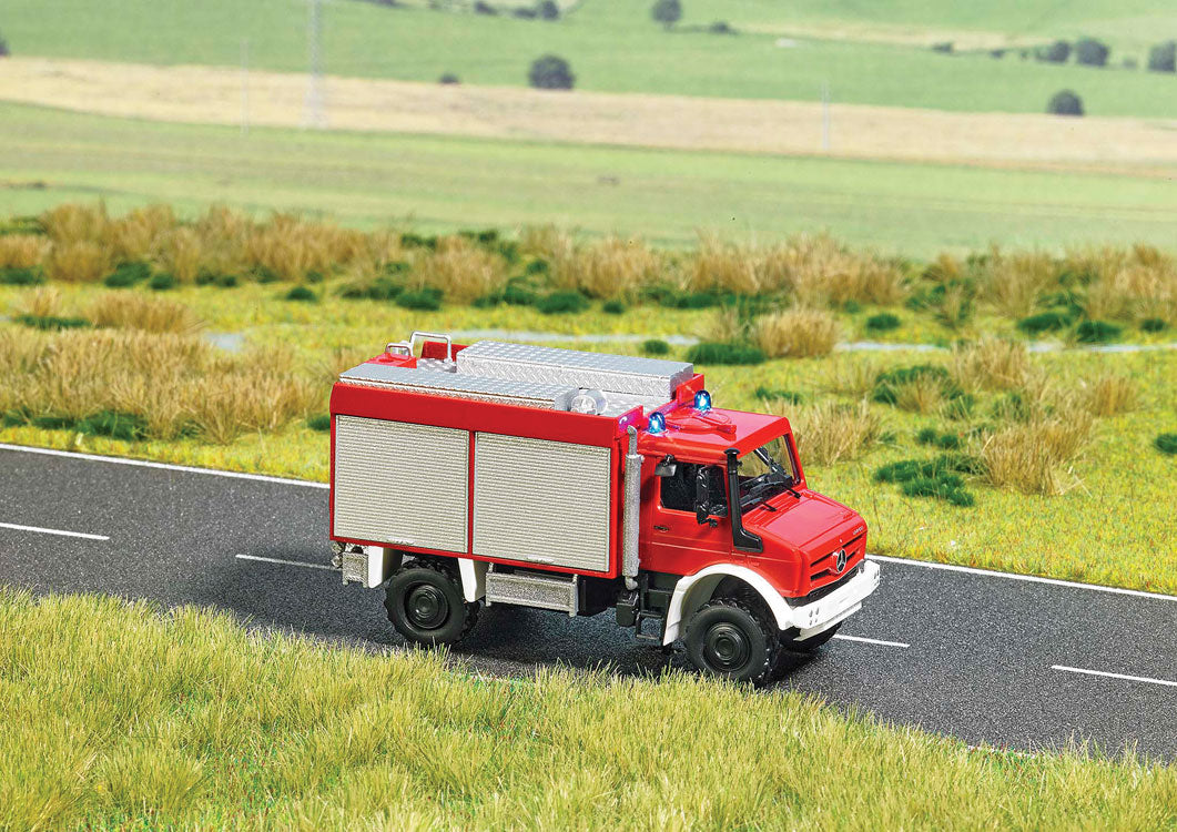 Unimog U 5023 Fire Truck w/Working Lights - Assembled -- Fire Department (red, white, German Letering)