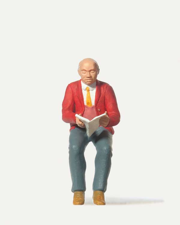 Seated Man Reading Paper