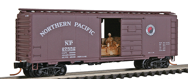 40' Standard Boxcar w/Sliding Door w/Man On Hay Bale Load -- Northern Pacific #27552 (Boxcar Red, white Logo, white Lettering)