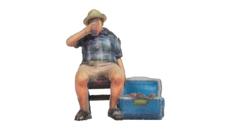 Man on a Folding Chair with Ice Chest