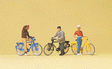 Cyclists Waiting At The Railroad Crossing -- 3 Riders & 3 Bicycles