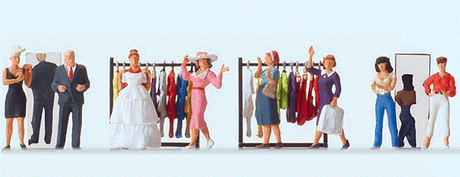 At The Fashion Shop -- 8 Figures & Clothes Racks