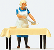 Individual Figure -- Housewife Serving Dinner at the Table