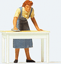 Individual Figure -- Housewife Cleaning the Table