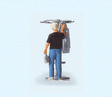 People At Home -- Man Hanging Up His Jacket