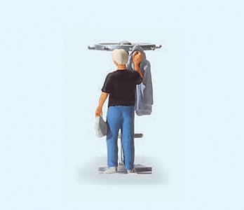 People At Home -- Man Hanging Up His Jacket