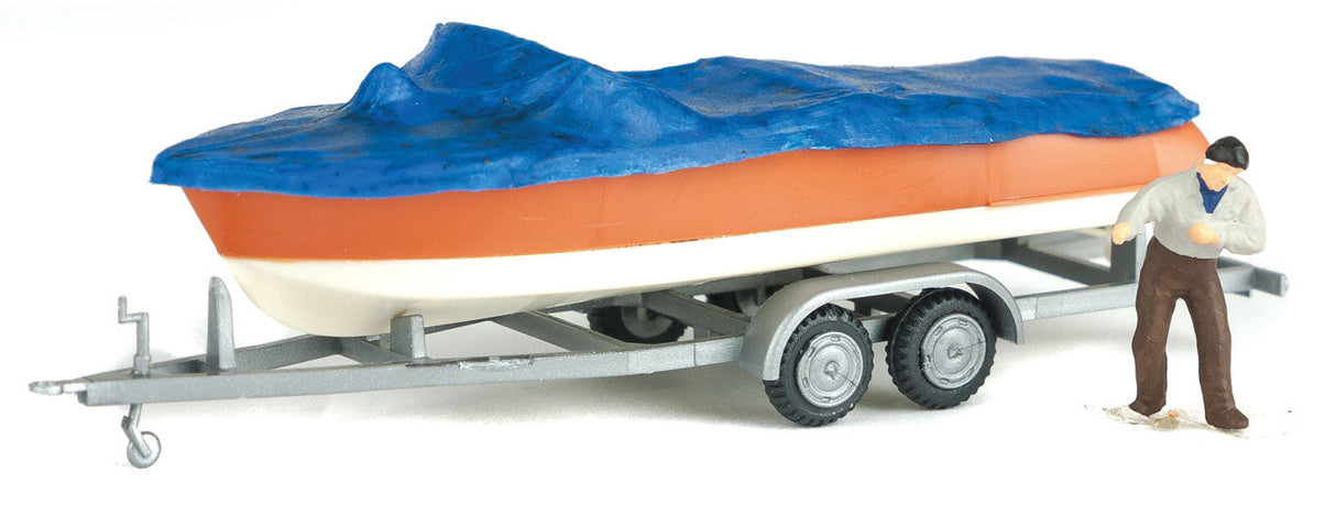 Motorboat w/Cover on Trailer