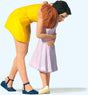 Woman Hugging Girl