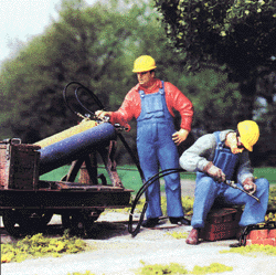 People Working -- Modern US Track Workers (welder & helper w/hardhats)