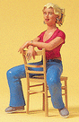 Pedestrian -- Young Woman Seated with Chair