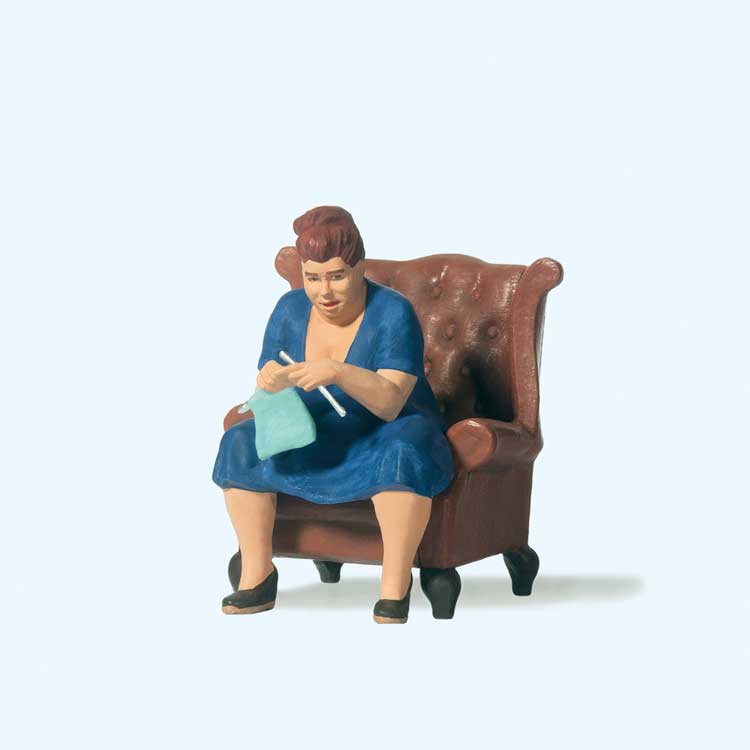 Woman Knitting on Chair