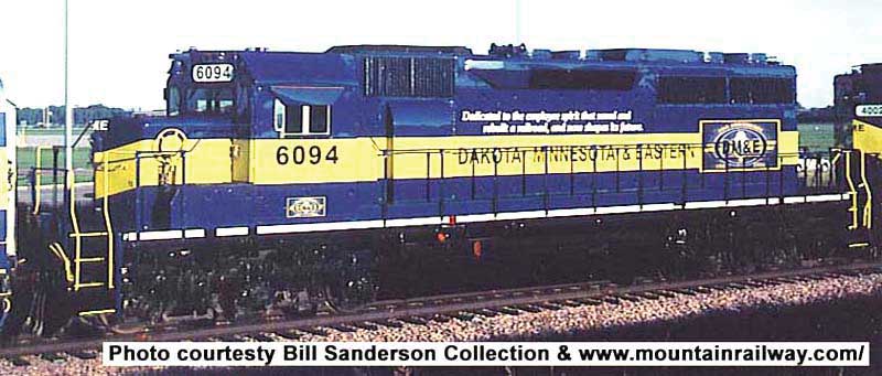 GMD SD40 - LokSound & DCC - Executive Line -- Dakota, Minnesota & Eastern 6094 (blue, yellow, Employee Dedication Scheme)