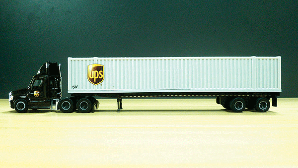 Semi Truck UPS Cascadia Day Cab w/53' Container on Chassis Trailer - Assembled -- United Parcel Service (brown Tractor, gray Trailer, Shield Logo)