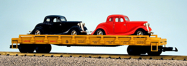 American Series - Auto Flatcars w/Load -- Union Pacific #666501 (yellow w/black & red Ford Coupes)