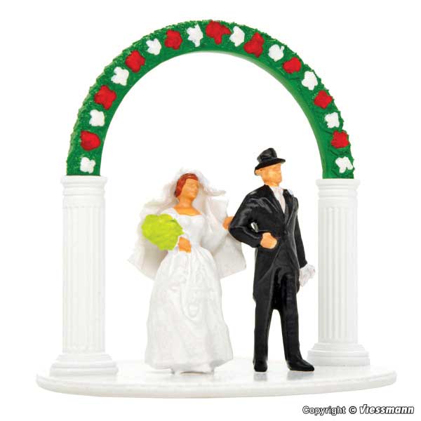 Bride and Groom with Wedding Arch-1